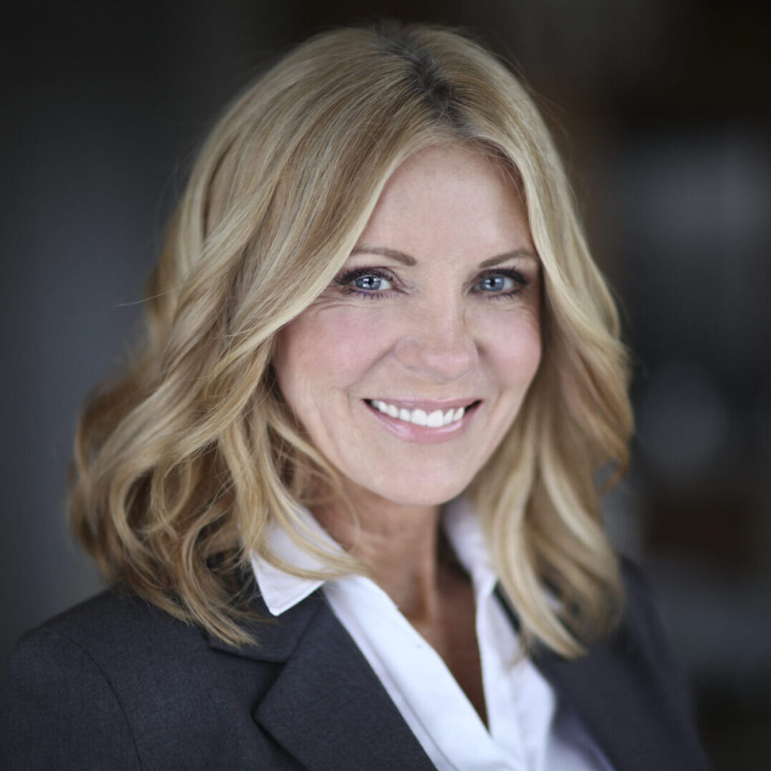 Portrait Of A Mature Businesswoman Smiling At The Camera